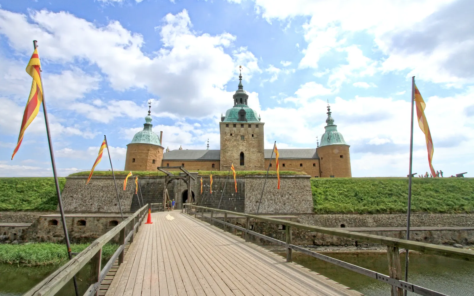 The wooden bridge and flags at the entrance to Kalmar Castle