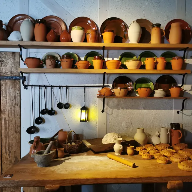 The castle kitchen at Kalmar Castle with pots and shelves