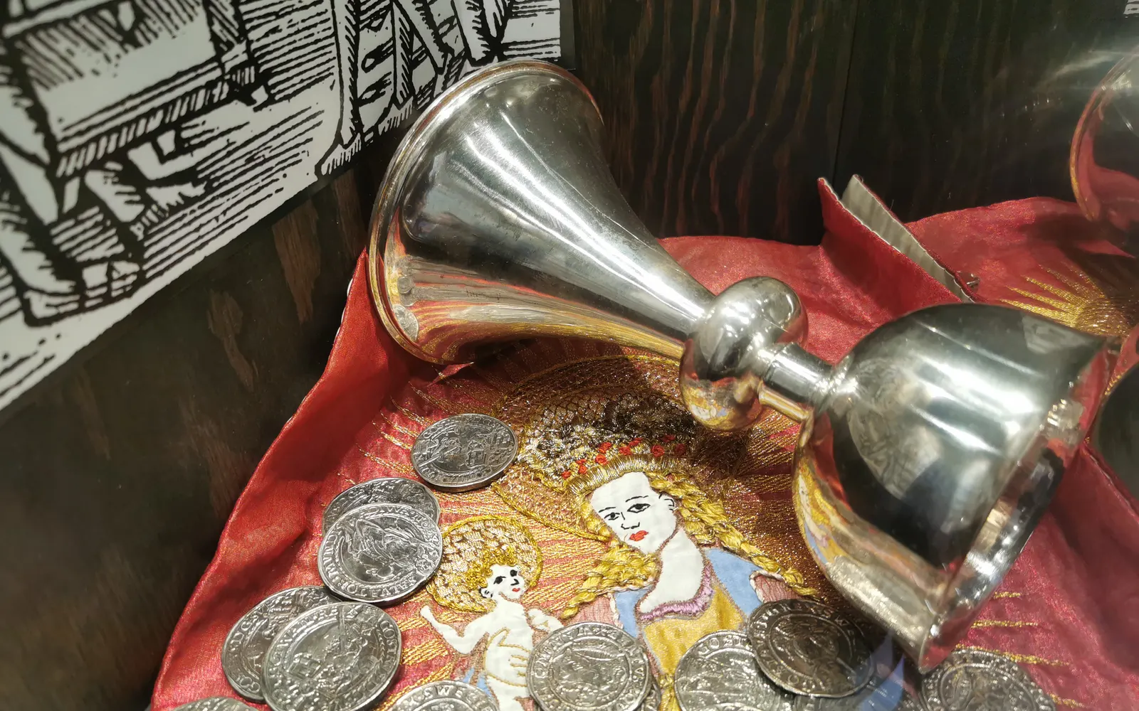 Silver chalices and coins in a display at Kalmar Castle